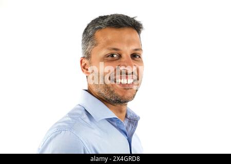 A man with a beard and gray hair is smiling for the camera Stock Photo