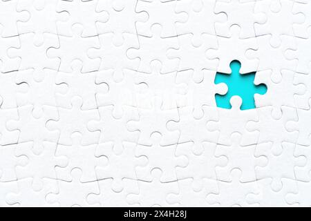Mockup of a fully assembled puzzle with a single missing element. Business and problem solving related background. Stock Photo
