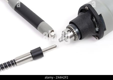 Mini drill chuck and flexible shaft parts close-up isolated on white. Stock Photo