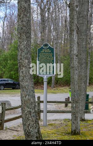The sign for the  Hesler Log House, an 1850's log house located at the Old Mission Point Lighthouse in Traverse City, Michigan. Stock Photo
