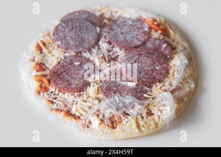 Frozen semi-finished pizza from the supermarket. Fast food concent Stock Photo