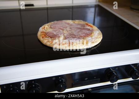 Frozen semi-finished pizza from the supermarket. Fast food concent Stock Photo