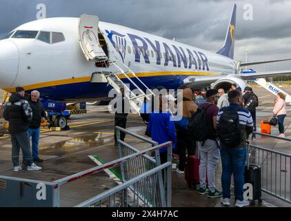 Ryanair Boeing 737 plane passengers waiting to board, London Stansted airport, Essex, England, UK Stock Photo