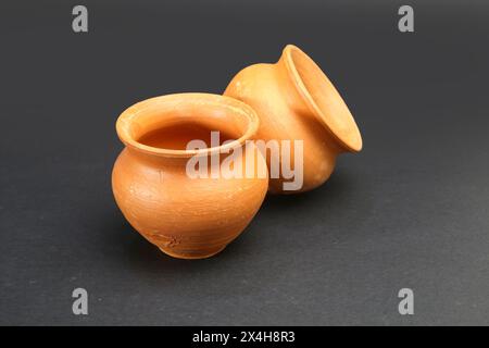 A pair of Clay pot isolated on Black background. Stock Photo