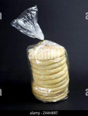 Sugar coated sponge cake with sugar top on black background. Stock Photo