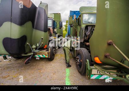 27 April 2024, Hesse, Alsfeld: Bundeswehr soldiers sit in an armored ...