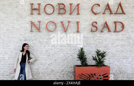 (240503) -- NOVI SAD, May 3, 2024 (Xinhua) -- Aleksandra Radovanovic waits for the train at Novi Sad railway station in Novi Sad, Serbia, April 29, 2024.The 27-year-old Aleksandra Radovanovic lives in Belgrade and works in Novi Sad. The operation of Belgrade-Novi Sad railway section has shorten her commute time to about 30 minutes. The Budapest-Belgrade railway is one of the flagship projects of China's Belt and Road Initiative.    The around 80-km-long, Belgrade-Novi Sad railway section started operation on March 19, 2022. (Xinhua/Li Ying) Stock Photo