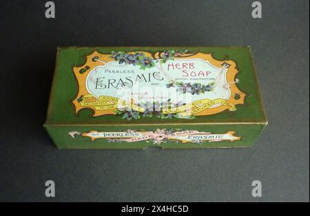 Circa. 1910 – An antique box made to contain Peerless Herb Soap, dating from the early 20th century. The box is decorated with an attractive Art Nouveau design incorporating the slogans, “Extra Quality, Delightful to Use and Exquisitely Perfumed”. Formed around 1869, Erasmic is a British brand originally specialising in perfumes, soaps and cosmetics, and later, shaving products. Stock Photo