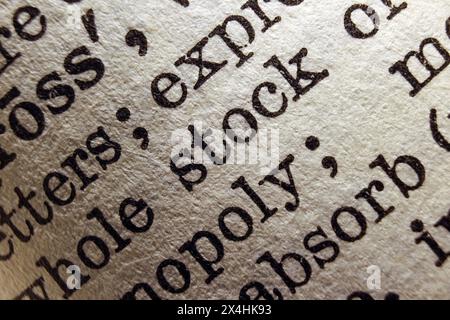 Word stock on dictionary page, macro close-up Stock Photo