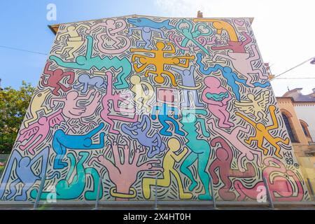 Pisa, Italy - 29 June 2023: Tuttomondo (All World) is the last mural created by American artist Keith Haring in 1989 before his death. Stock Photo