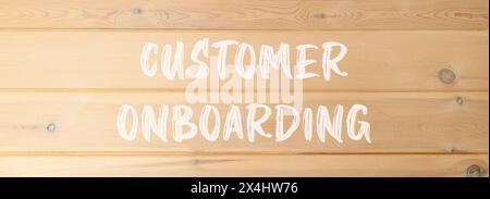 Customer onboarding symbol. Concept words Customer onboarding on beautiful wooden wall. Beautiful wooden wall background. Business Customer onboarding Stock Photo