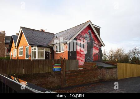 England, Liverpool - December 29, 2023: Bill Shankly mural on a house in Anfield Road. Stock Photo