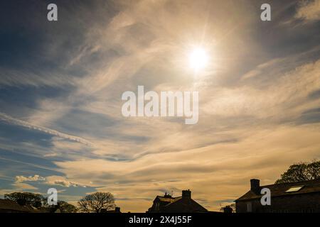 A spring HDR image of a cloudscape over Grassington, North Yorkshire, England with four types of cloud formations and contrails. 30 April 2024 Stock Photo