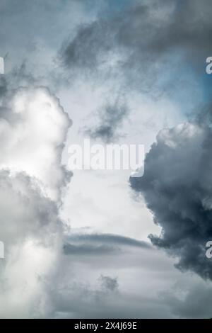 Strange shapes of white and dark clouds in the sky Stock Photo