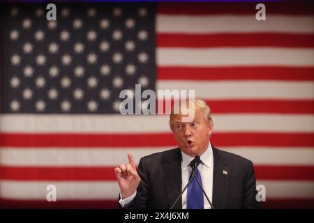 Republican presidential candidate Donald Trump gestures as he speaks to veterans at Drake University on January 28, 2016 in Des Moines, Iowa. Stock Photo