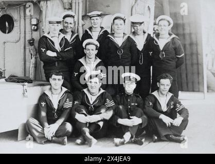 Royal Navy stokers and a Royal Marine of HMS Birmingham, c.1920. Stock Photo