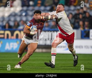 Esan Marsters of Huddersfield Giants is tackled by Brad Singleton of Salford Red Devils during the Betfred Super League Round 10 match Huddersfield Giants vs Salford Red Devils at John Smith's Stadium, Huddersfield, United Kingdom, 3rd May 2024  (Photo by Craig Thomas/News Images) Stock Photo