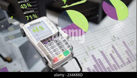 Image of financial data processing over payment terminal Stock Photo