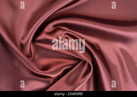 Red brown silk fabric texture as background. Stock Photo