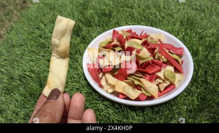 Mix veg roasted chips, vegetables like beetroot, spinach, pumpkin, made of whole wheat flour and vegetable pulp. Tasty crispy papad snacks Stock Photo