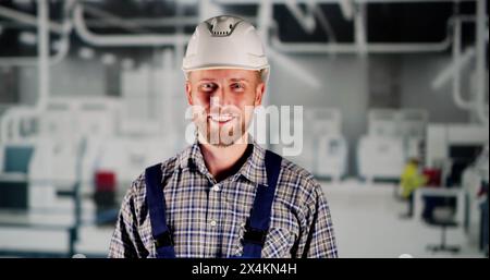 Industrial Job And Factory Worker Technician In Safety Uniform Stock Photo