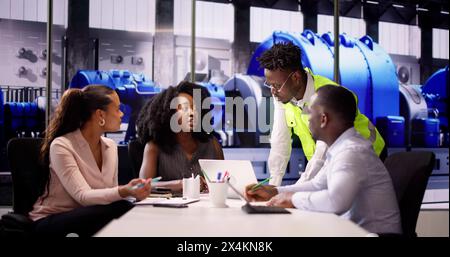 Business People And Workers Team At Power Plant Stock Photo