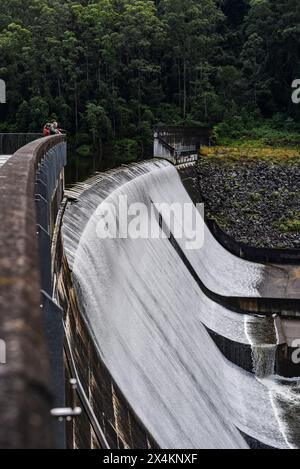 water spilling over the dam wall Stock Photo