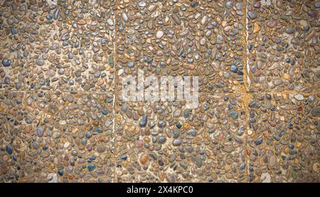 The rough texture surface of exposed aggregate finish, Ground stone washed floor, made of small sand stone in light brown color Stock Photo