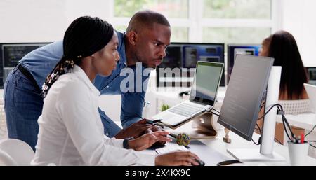 African team of programmers working on computer code business Stock Photo