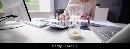 Late Payment Deadline Looming on Invoice Desk Time Stock Photo