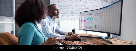 African American businessman analyzing financial data for business. Stock Photo