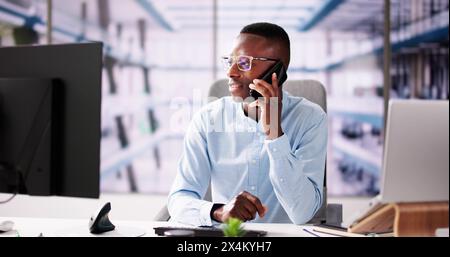 Business Man Using Mobile Phone Technology And Laptop Stock Photo