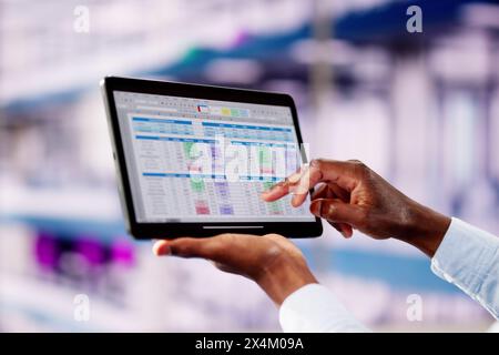 Professional Analyst Employee Using Spreadsheet Data On Laptop Computer Stock Photo