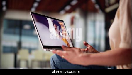 Watching TV Video On Laptop At Sofa Or Couch Stock Photo