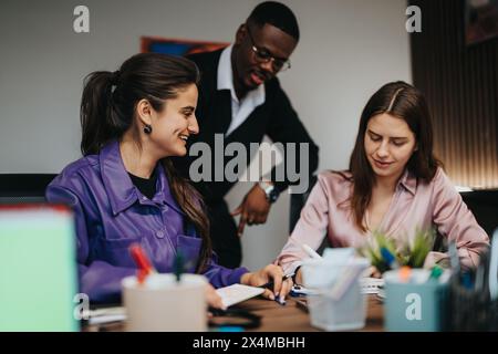 Multicultural business team collaborates in modern co-working space Stock Photo