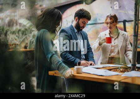 Business partners discussing strategy over coffee in casual setting Stock Photo