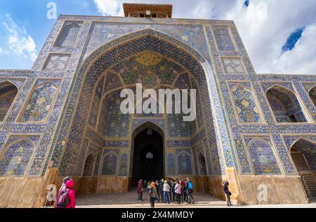 Isfahan, Iran - March 5, 2024: The entrance to the Imam Mosque is flanked by two towering minarets decorated with bright blue tiles. An atmosphere of Stock Photo