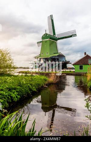 Old wooden windmills in the town of Zaanse Schans in the Netherlands Stock Photo