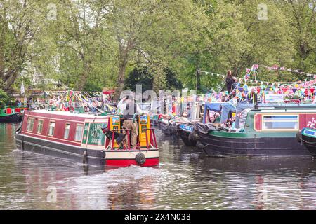 London, UK, 04th May 2024. The annual IWA Canalway Cavalcade returns to Little Venice for the Early May Bank Holiday weekend, celebrating Britains waterways and their community. It features around 100 decorated boats, a waterway procession, activities and entertainment. Stock Photo