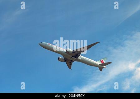 London, England, UK - 29 April 2024: Air Canada Boeing 777 jet (registration C-FNNW) climbing after take off from London Heathrow airport. Stock Photo