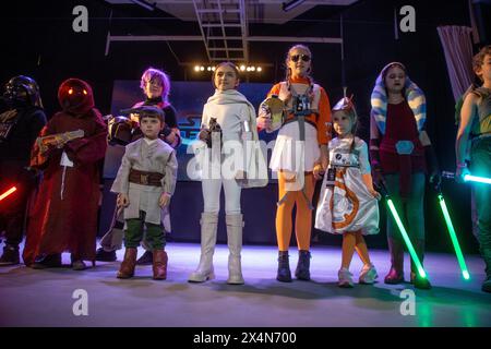 Moscow, Russia. 4th of May, 2024. Star Children take part in a costume contest for characters of the Star Wars universe inside the Culture and Sports Center during the Star Wars day celebration in Moscow, Russia. Star Wars Day is celebrated every 04 May by many fans in different parts of the world. Credit: Nikolay Vinokurov/Alamy Live News Stock Photo