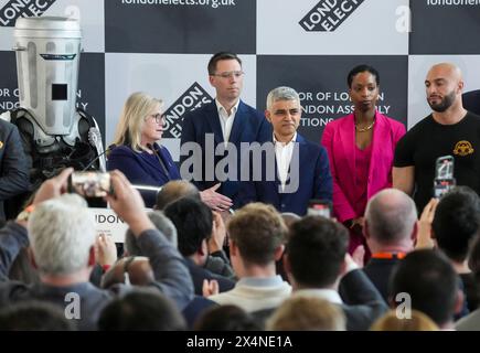 Labour's Sadiq Khan (centre) is re-elected as the Mayor of London, at City Hall, London as Count Binface (left), Conservative party candidate Susan Hall (second left), Liberal Democrat candidate Rob Blackie, Independent candidate Natalie Campbell and Independent candidate Andreas Michli (right) look on. Picture date: Saturday May 4, 2024. Stock Photo