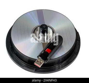 Horizontal close-up shot of a high capacity USB Flash On Stack of CD Discs. Stock Photo