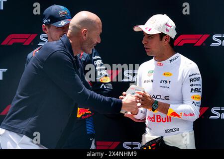 Miami Gardens, United States. 04th May, 2024. Retired French professional footballer Zinedine Zidane presents a plaque Mexican Formula One driver Sergio Pérez of Red Bull Racing for finishing third in the sprint race during the Formula One Miami Grand Prix at the Miami International Autodrome in Miami Gardens, Florida on Saturday, May 4, 2024 Photo by Greg Nash/UPI. Credit: UPI/Alamy Live News Stock Photo