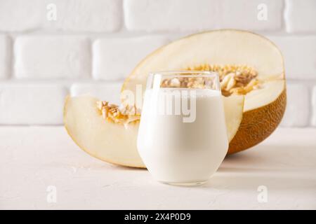 Alternative melon seeds milk and seeds on white background. Close up. Stock Photo
