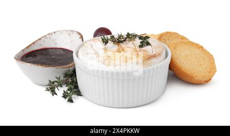 Tasty baked camembert, croutons and jam isolated on white Stock Photo