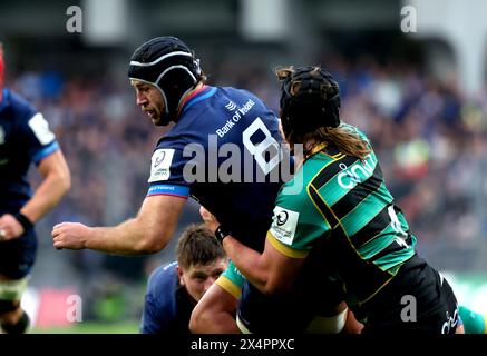 Leinster Rugby's Caelan Doris (left) is tackled by Northampton Saints' Alexander Moon during the Investec Champions Cup semi-final match at Croke Park, Dublin. Picture date: Saturday May 4, 2024. Stock Photo