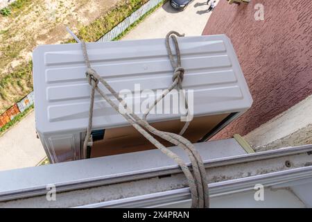 Installing an air conditioner in an apartment office Lviv Ukraine 08.04.24 Stock Photo