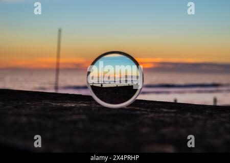 Sunset on the beach trough a lens Stock Photo