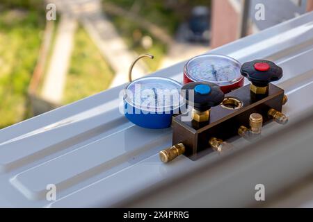 Air conditioning, HVAC service technician using gauges Lviv Ukraine 08.04.24 Stock Photo